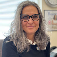 Image is of Maria McKrakken in her office.